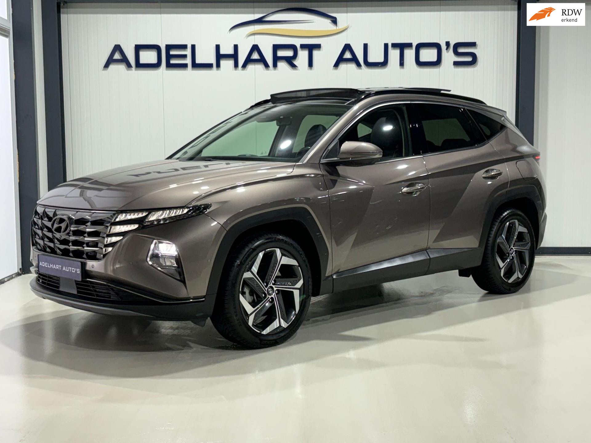 Hyundai Tucson 1.6 T-GDI HEV Premium Sky Automaat / Panorama dak / Lederen interieur / Elektrische Stoelen / full option 50085854-0.jpg | Adelhart Auto's